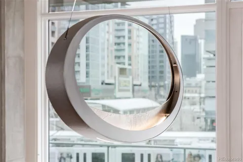 a view of a wooden floor and a mirror in a room