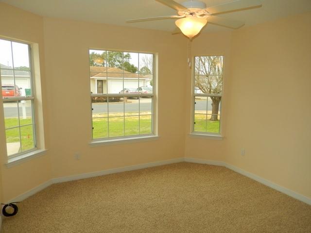 9 Stowe Road Mary Esther, FL 32569 - Photo 15 of 24 an empty room with windows and fan