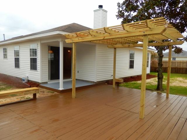 9 Stowe Road Mary Esther, FL 32569 - Photo 18 of 24 a view of a house with wooden floor and fence