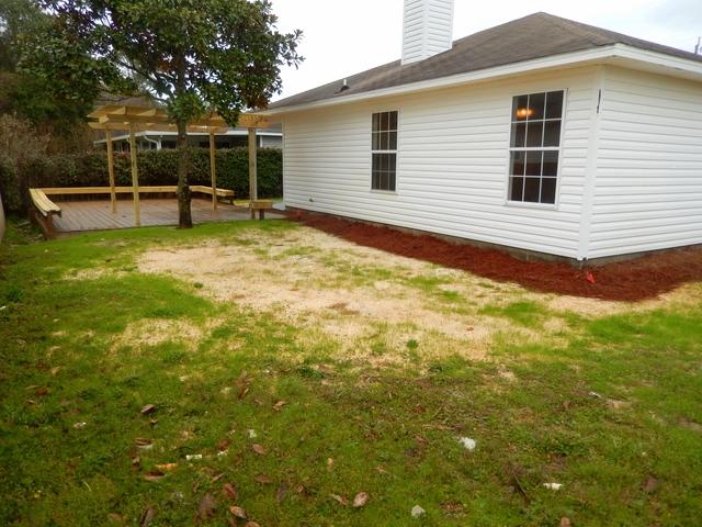 9 Stowe Road Mary Esther, FL 32569 - Photo 20 of 24 a view of a backyard with table and chairs and wooden fence