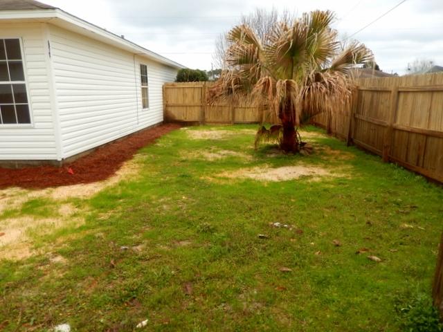 9 Stowe Road Mary Esther, FL 32569 - Photo 21 of 24 a view of a backyard