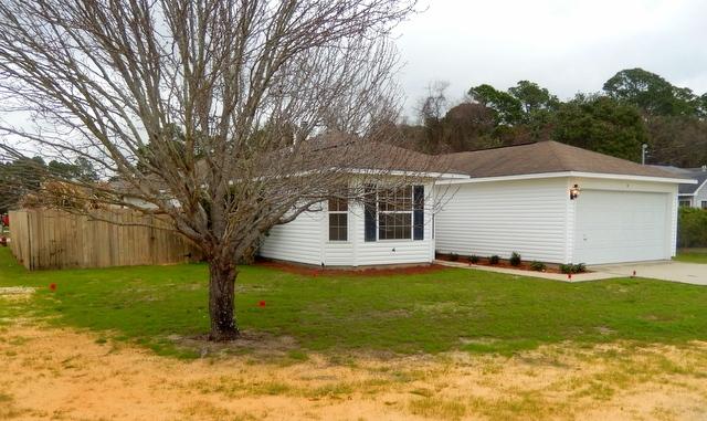 9 Stowe Road Mary Esther, FL 32569 - Photo 24 of 24 a view of a house with a yard