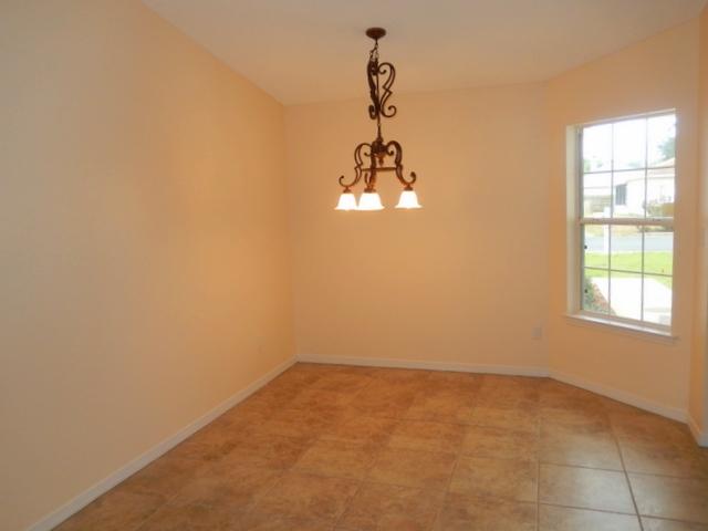 9 Stowe Road Mary Esther, FL 32569 - Photo 4 of 24 an empty room with a window