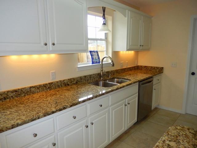 9 Stowe Road Mary Esther, FL 32569 - Photo 8 of 24 a kitchen with granite countertop white cabinets and sink