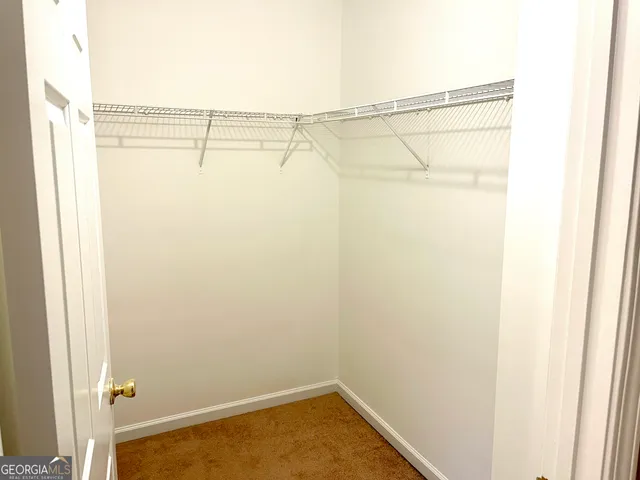 a view of a room with racks on the wall