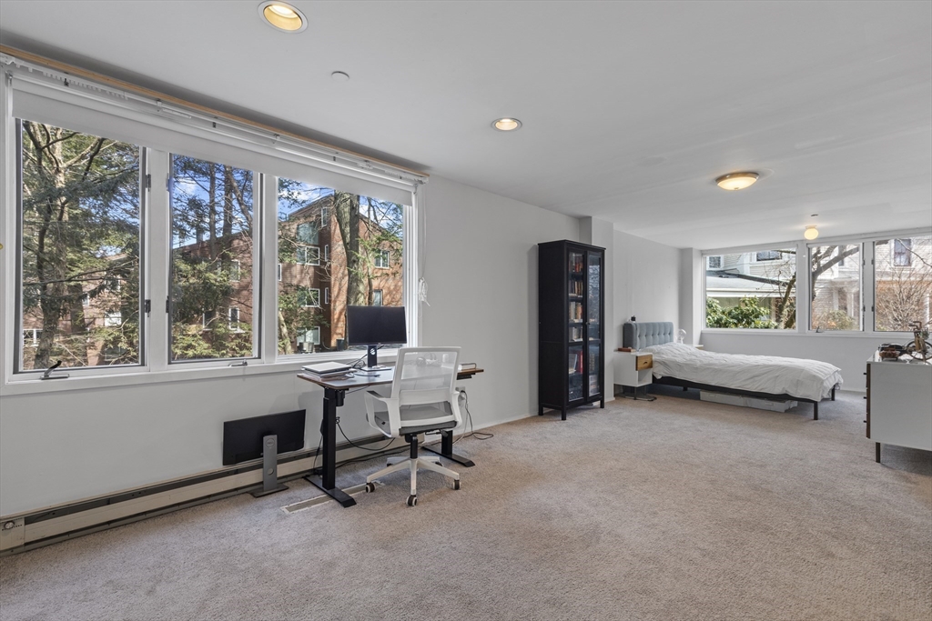 241 Perkins Street, Unit D405 Boston, MA 02130 - Photo 13 of 36 a view of a livingroom with workspace and a window