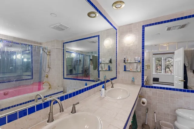 a bathroom with a sink and a large mirror