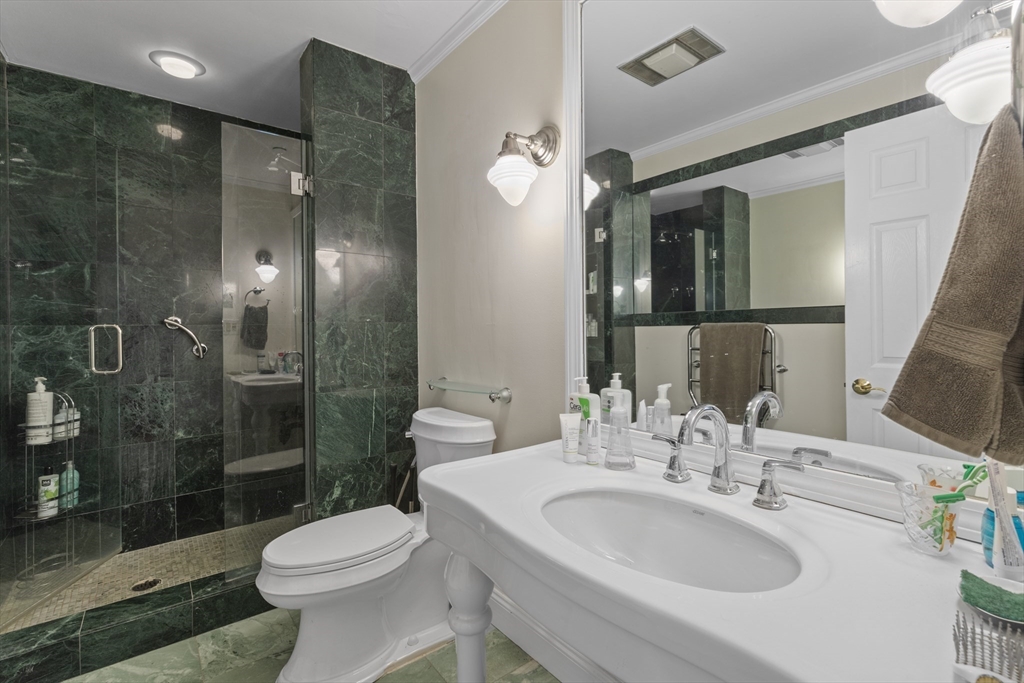 241 Perkins Street, Unit D405 Boston, MA 02130 - Photo 16 of 36 a bathroom with a sink toilet and shower