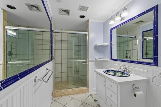 a bathroom with a sink a vanity and mirror