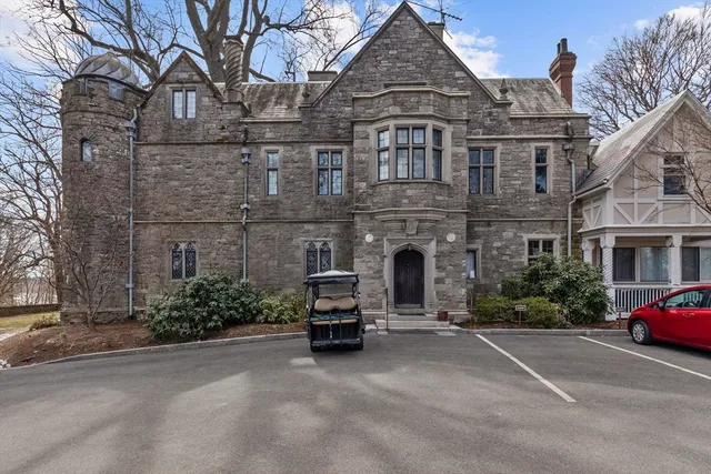 a view of a house with floor to ceiling windows and a basket ball poll