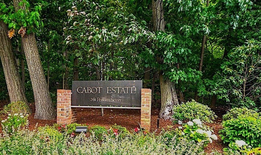 241 Perkins Street, Unit D405 Boston, MA 02130 - Photo 36 of 36 a sign that is sitting in front of a tree