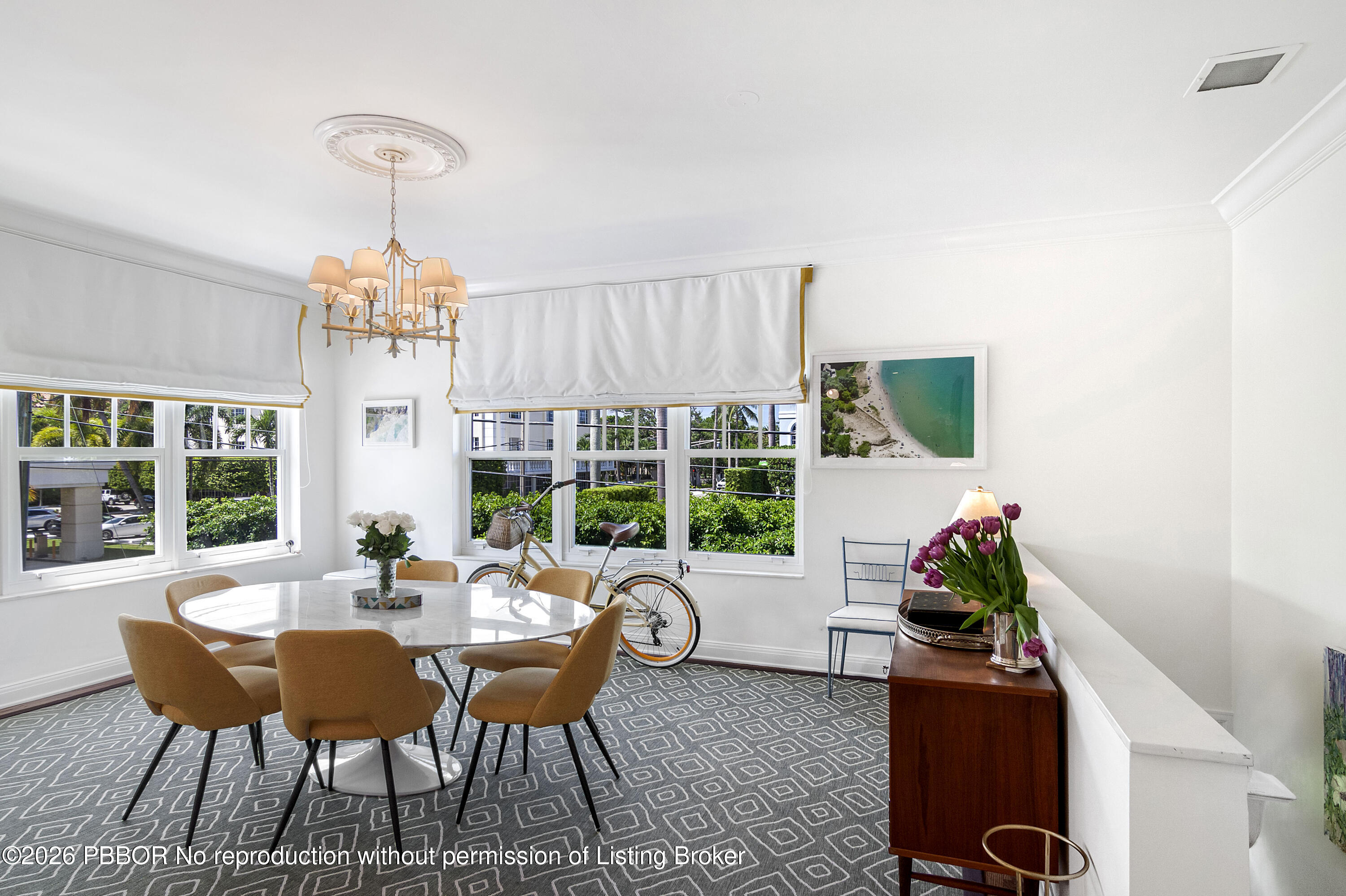 311 Cocoanut Row, Unit 201 Palm Beach, FL 33480 - Photo 2 of 12 a dining room with furniture a livingroom and chandelier