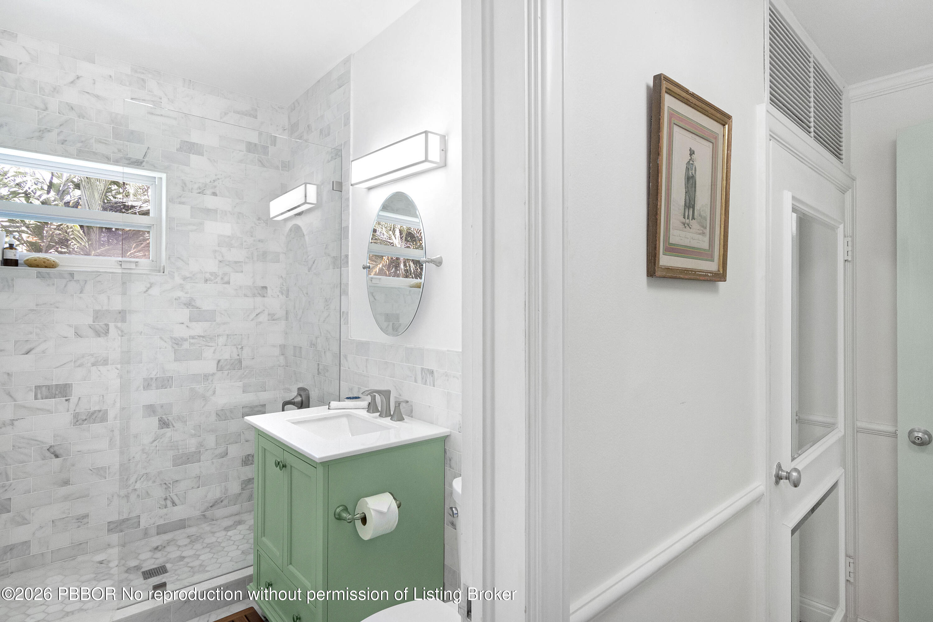 311 Cocoanut Row, Unit 201 Palm Beach, FL 33480 - Photo 6 of 12 a bathroom with a sink and mirror
