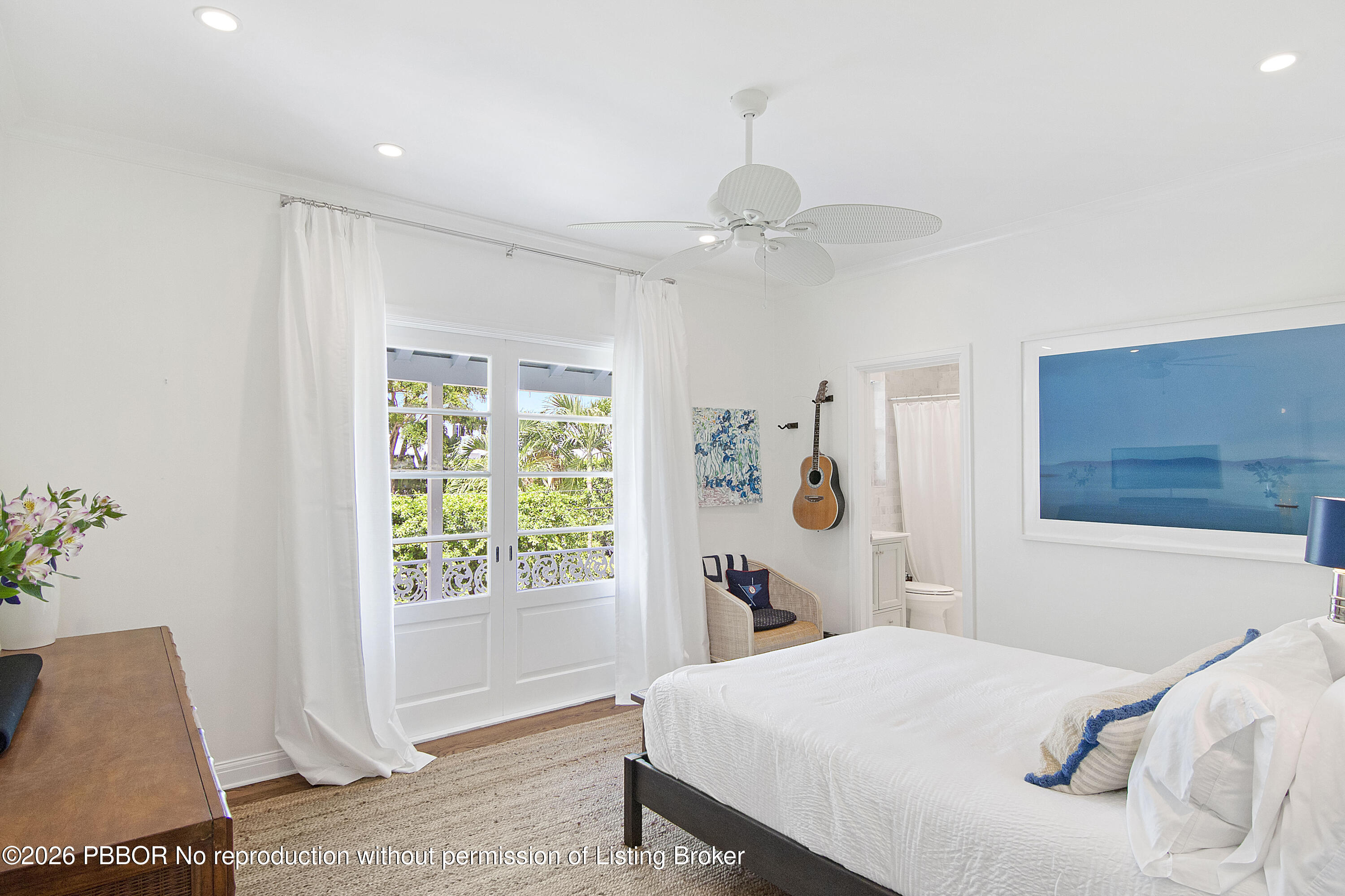 311 Cocoanut Row, Unit 201 Palm Beach, FL 33480 - Photo 8 of 12 a bedroom with a bed and a window