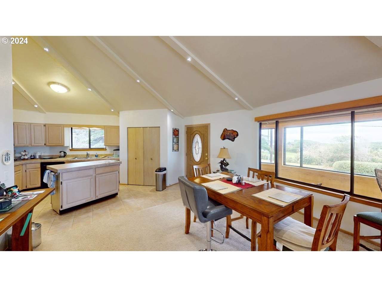 33327 Ophir Road Gold Beach, OR 97444 - Photo 13 of 32 a living room with furniture and a large window