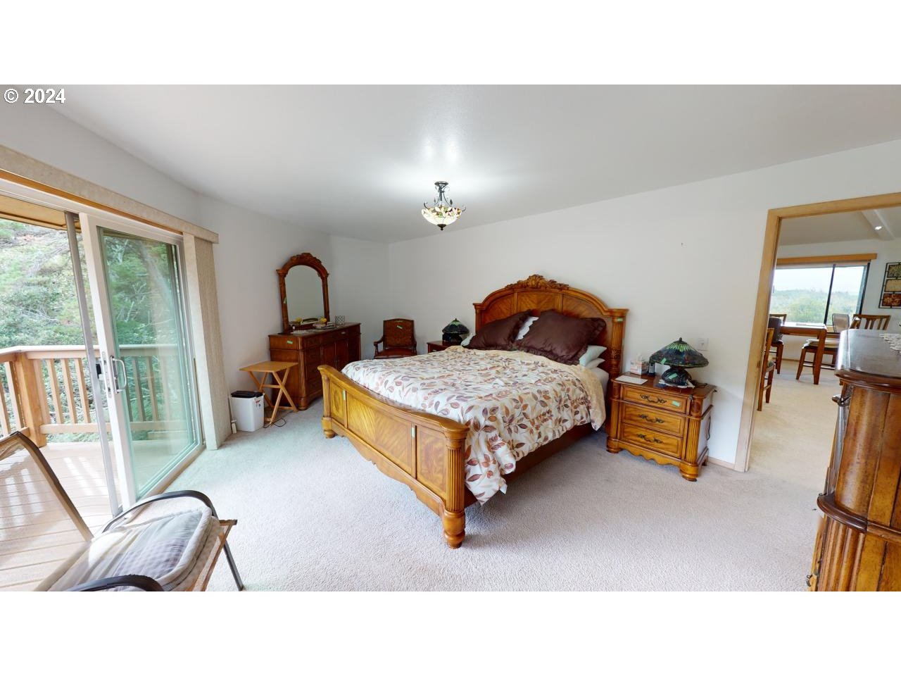 33327 Ophir Road Gold Beach, OR 97444 - Photo 18 of 32 a living room with furniture rug and a large window