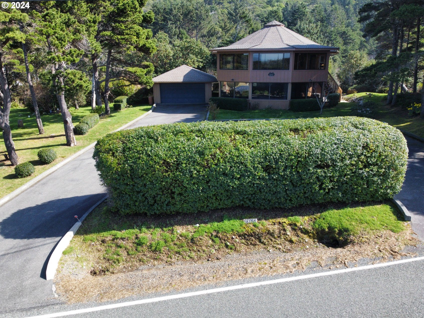 33327 Ophir Road Gold Beach, OR 97444 - Photo 2 of 32 a front view of a house with a yard