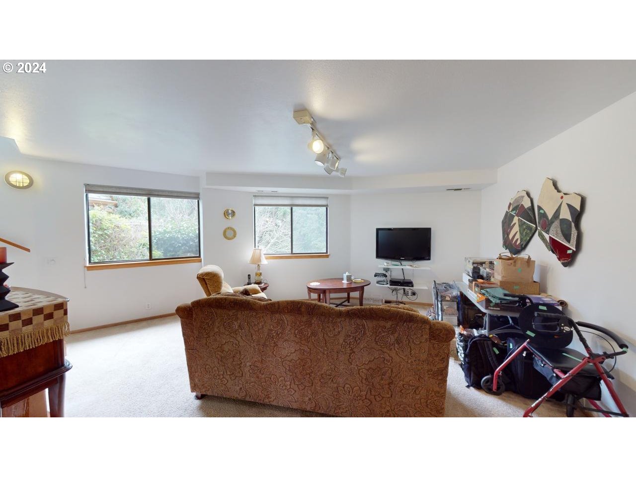 33327 Ophir Road Gold Beach, OR 97444 - Photo 22 of 32 a living room with furniture and a flat screen tv