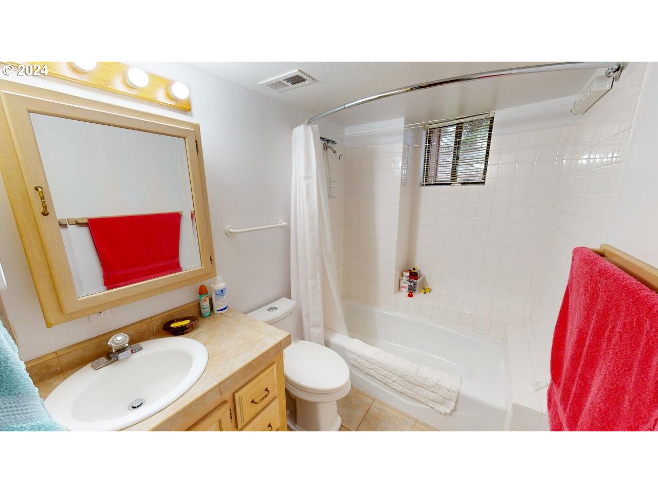 33327 Ophir Road Gold Beach, OR 97444 - Photo 25 of 32 a bathroom with a sink vanity mirror and toilet