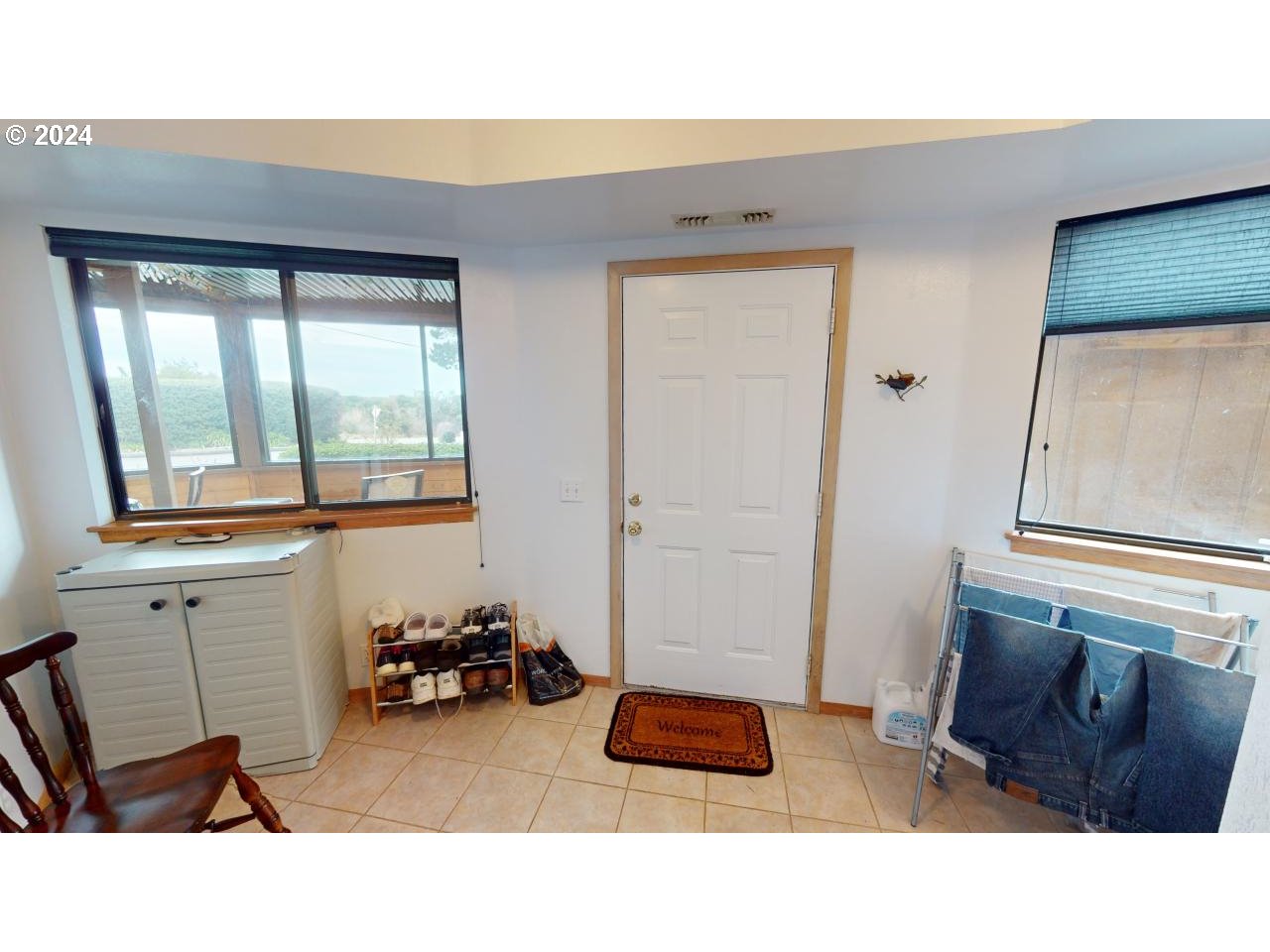 33327 Ophir Road Gold Beach, OR 97444 - Photo 27 of 32 a room with furniture and a window