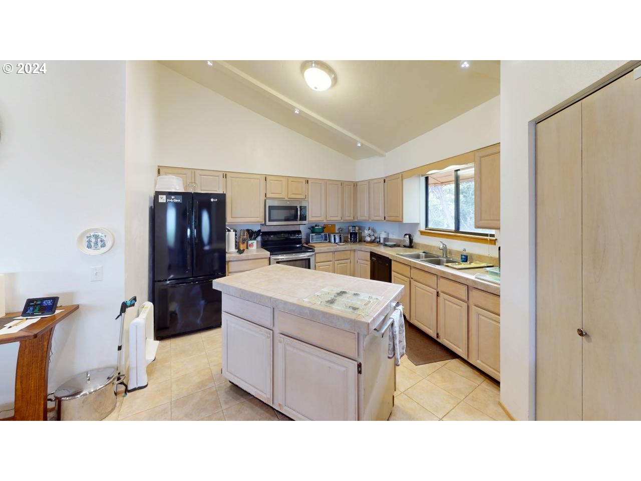 33327 Ophir Road Gold Beach, OR 97444 - Photo 29 of 32 a kitchen with appliances a sink and cabinets