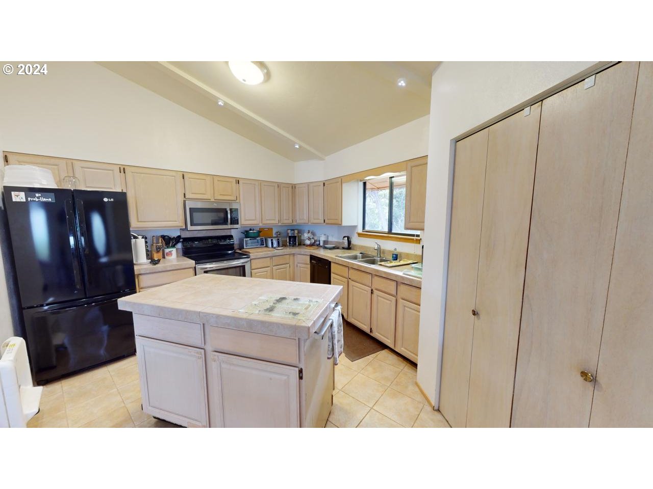 33327 Ophir Road Gold Beach, OR 97444 - Photo 9 of 32 a kitchen with appliances cabinets and a sink