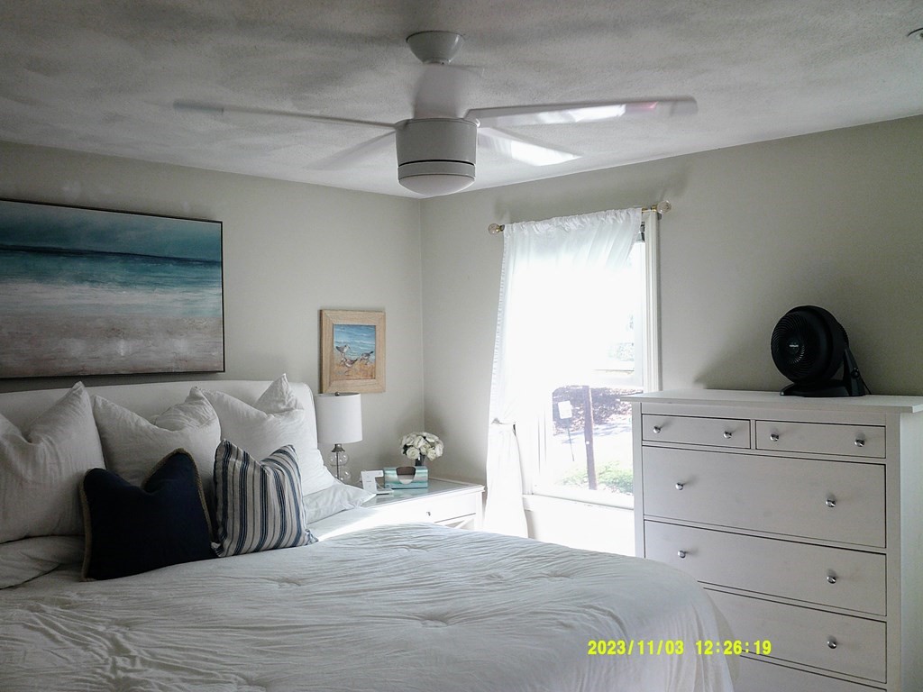 77 Indian Run Road, Unit 77 Bellingham, MA 02019 - Photo 15 of 18 a bedroom with a bed and a window