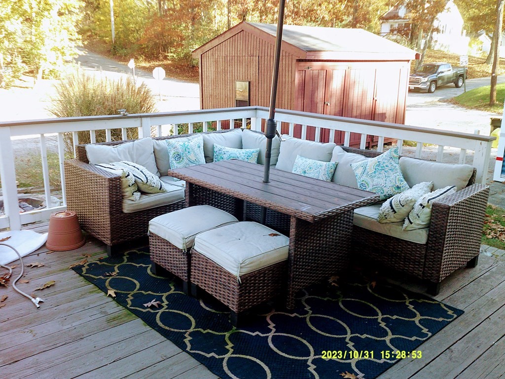77 Indian Run Road, Unit 77 Bellingham, MA 02019 - Photo 6 of 18 a roof deck with couches and wooden floor