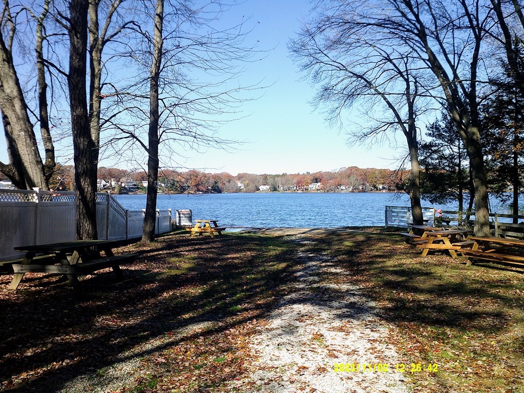 77 Indian Run Road, Unit 77 Bellingham, MA 02019 - Photo 9 of 18 a view of a large body of water with a house in the background