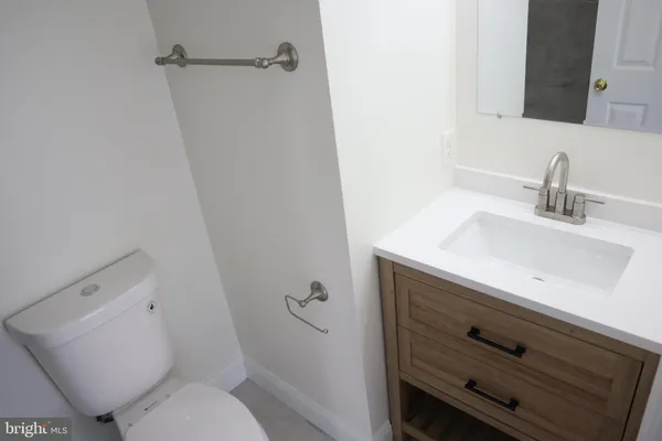 a bathroom with a sink toilet and vanity