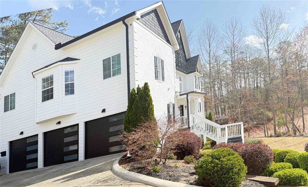 a front view of a house with garden