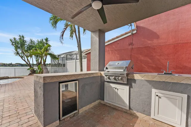 a kitchen with a stove and a white refrigerator