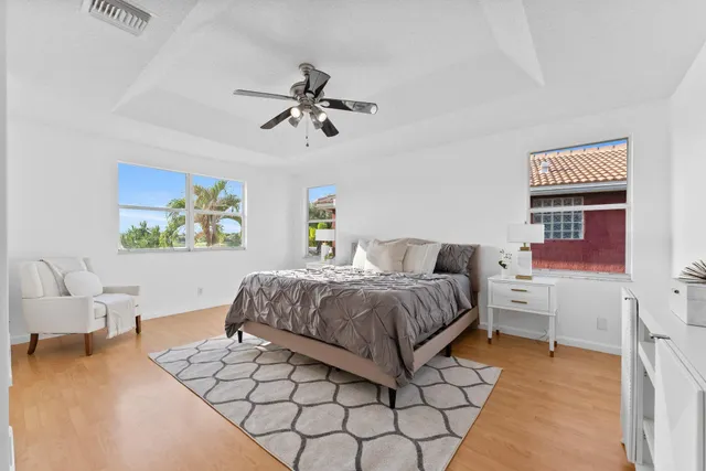 a bedroom with a bed and a couch