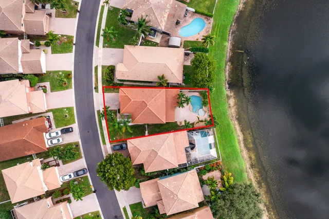 an aerial view of a house with outdoor space