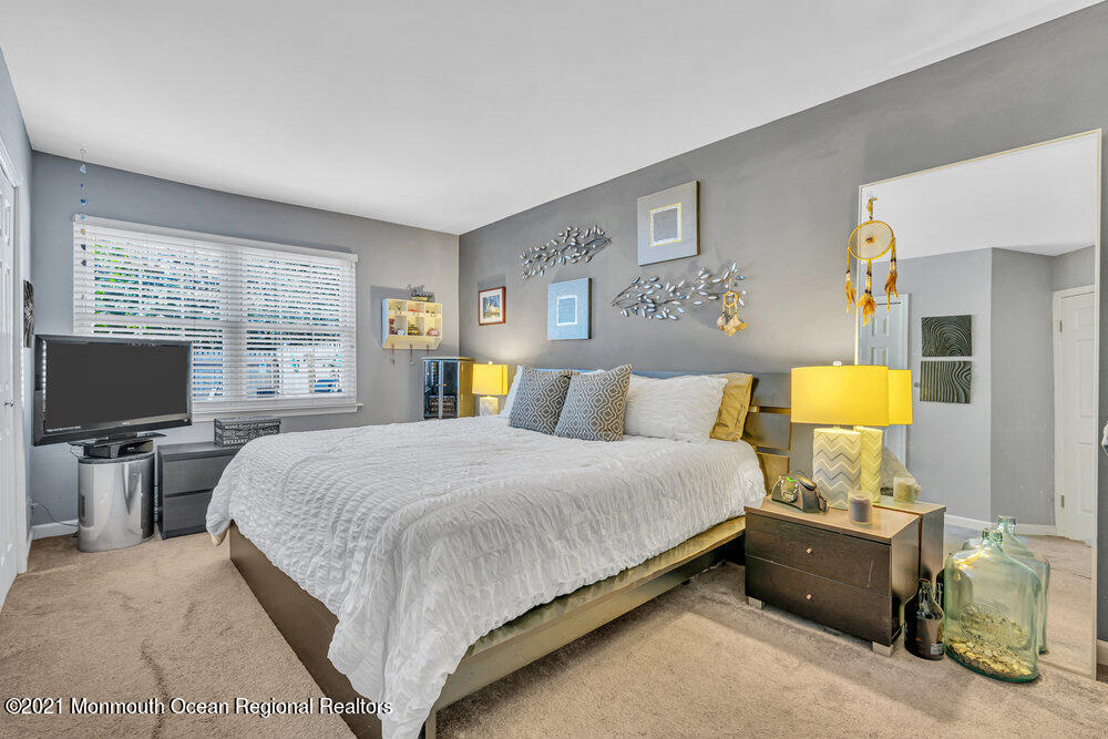 39 Bramble Lane Matawan, NJ 07747 - Photo 12 of 28 a bedroom with a bed and window