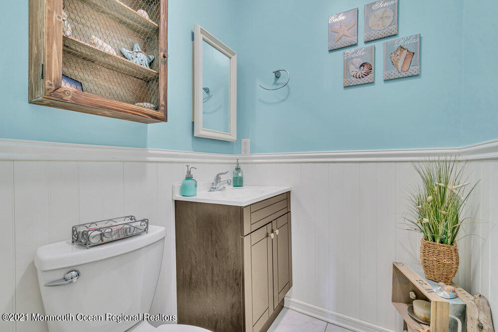 39 Bramble Lane Matawan, NJ 07747 - Photo 18 of 28 a bathroom with a sink and a mirror