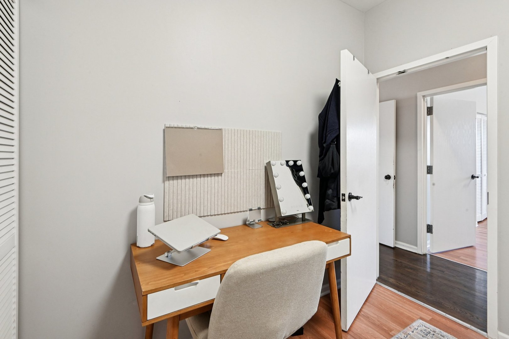 828 West 31st Street, Unit 3N Chicago, IL 60608 - Photo 15 of 29 a bedroom with a bed and a flat screen tv