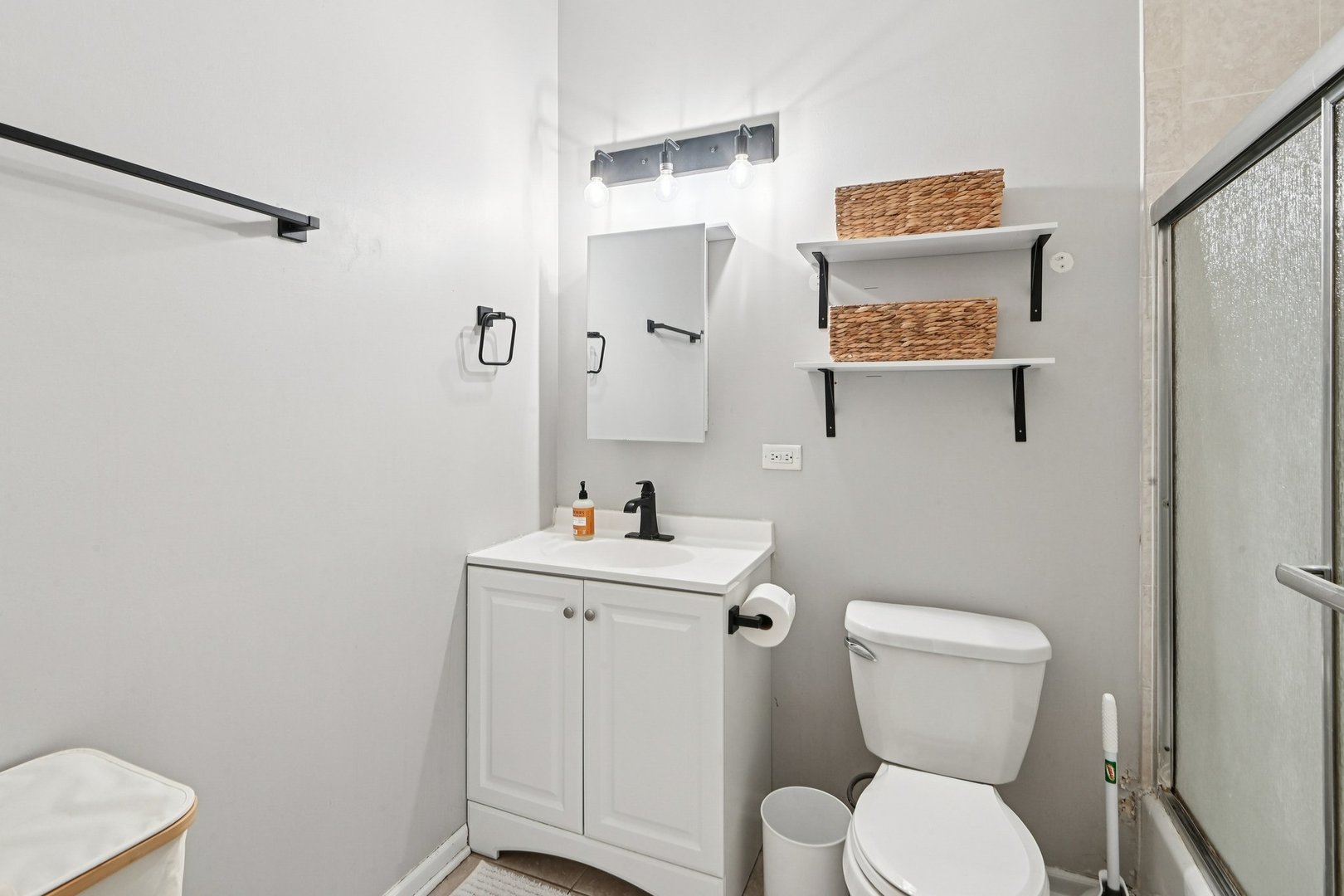 828 West 31st Street, Unit 3N Chicago, IL 60608 - Photo 19 of 29 a bathroom with a toilet a sink and wooden floor