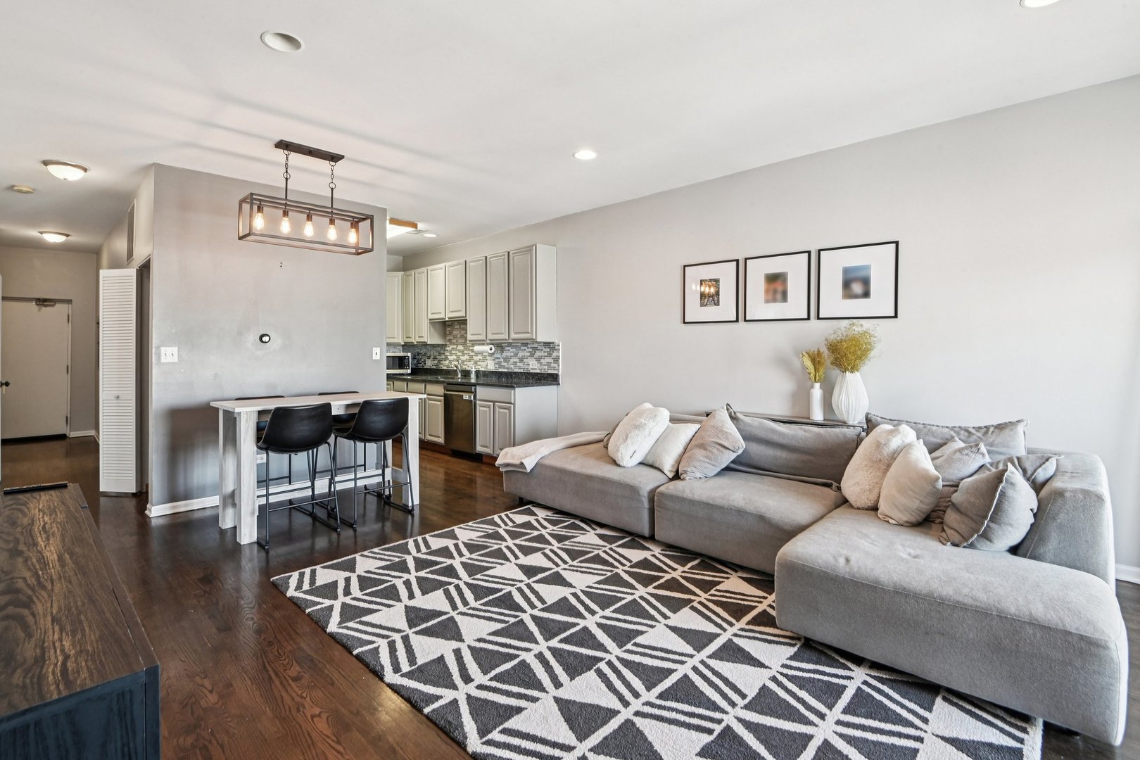 828 West 31st Street, Unit 3N Chicago, IL 60608 - Photo 2 of 29 a living room with furniture and a dining table