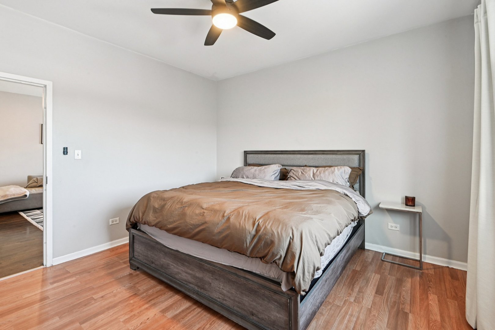 828 West 31st Street, Unit 3N Chicago, IL 60608 - Photo 21 of 29 a bedroom with a bed and wooden floor