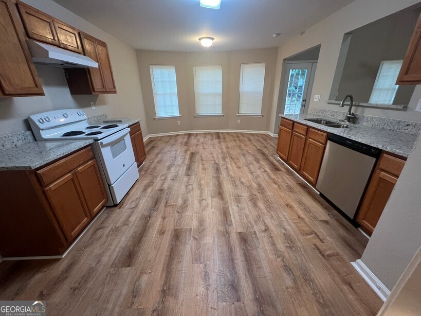 95 Creek Way Covington, GA 30016 - Photo 11 of 25 a spacious bathroom with a sink and a mirror