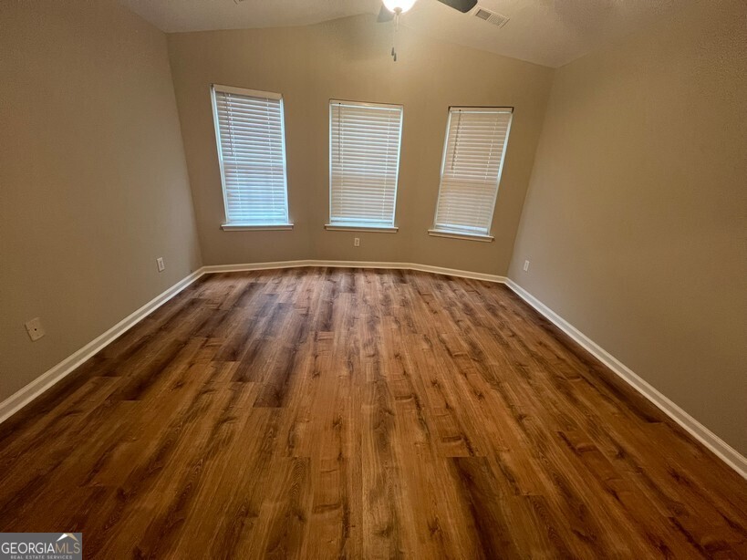 95 Creek Way Covington, GA 30016 - Photo 13 of 25 a view of an empty room and window