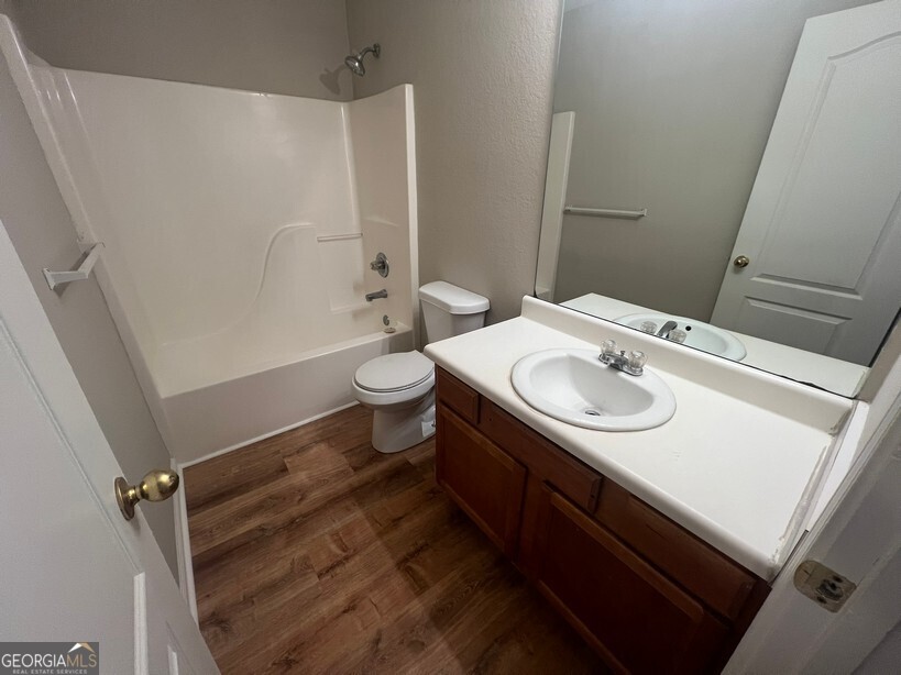 95 Creek Way Covington, GA 30016 - Photo 22 of 25 a bathroom with a sink toilet and shower