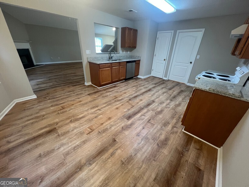 95 Creek Way Covington, GA 30016 - Photo 8 of 25 a bedroom with a bed and a television