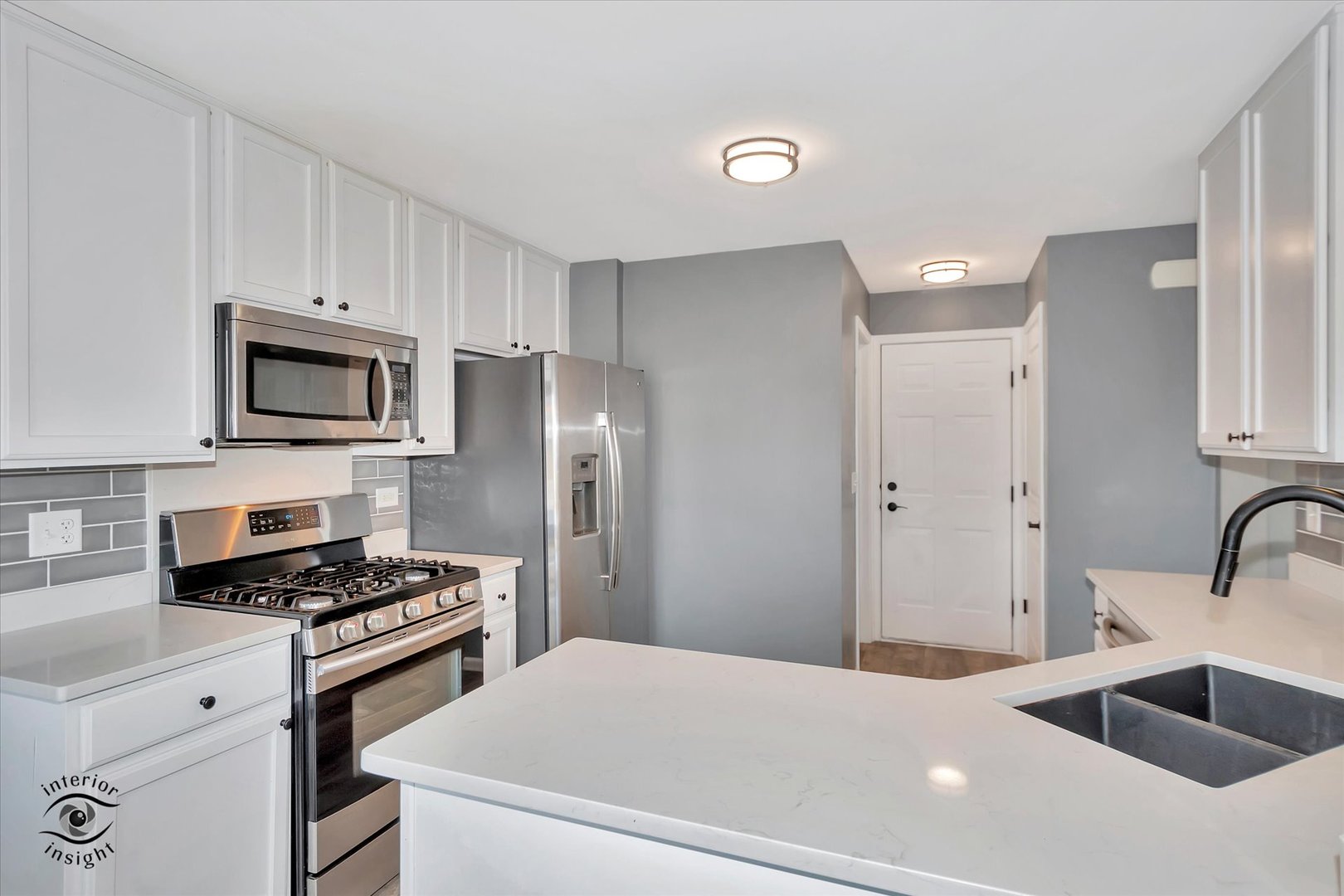 15128 Pinewood Road Lockport, IL 60441 - Photo 5 of 27 a kitchen with stainless steel appliances a refrigerator stove and microwave