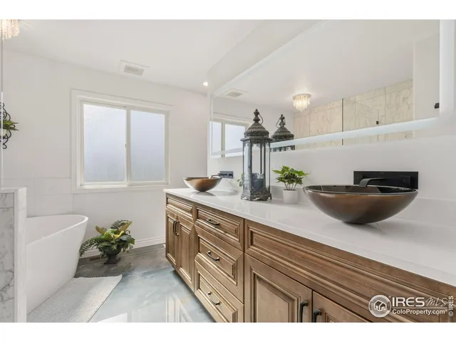 a view of living room with a sink and chandelier