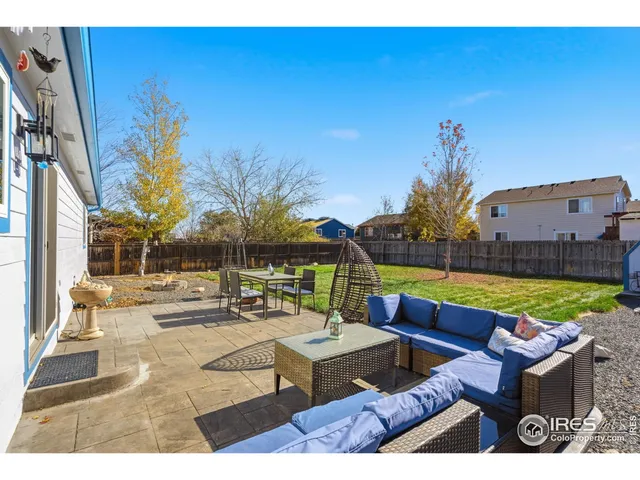 a view of swimming pool with outdoor seating and a couch