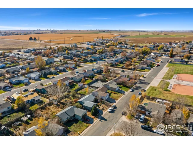 an aerial view of residential building and ocean