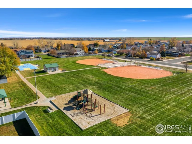 a view of a swimming pool with an outdoor space and seating area