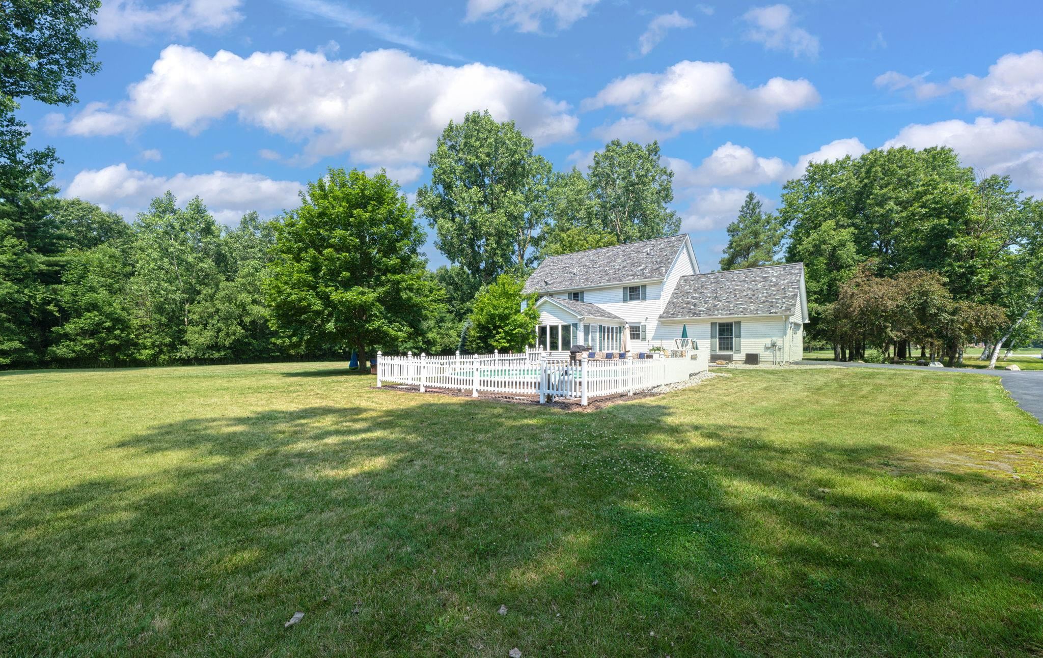 4793 Ketchum Road St. Clair, MI 48079 - Photo 29 of 36 Manicured gardens, a sparkling pool, and ample outdoor entertaining areas create a resort-like atmosphere